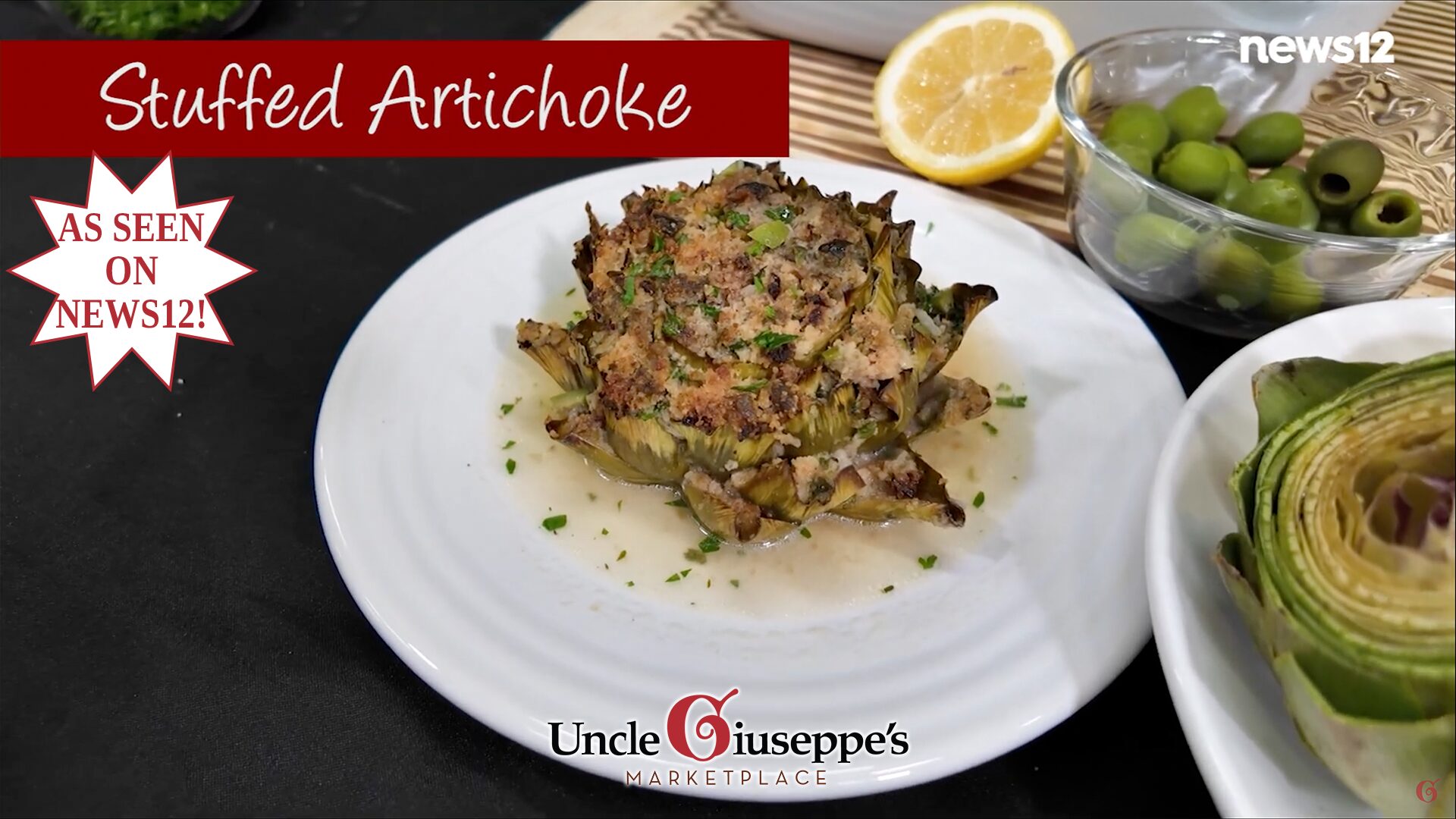 Stuffed artichoke on a white plate with a lemon