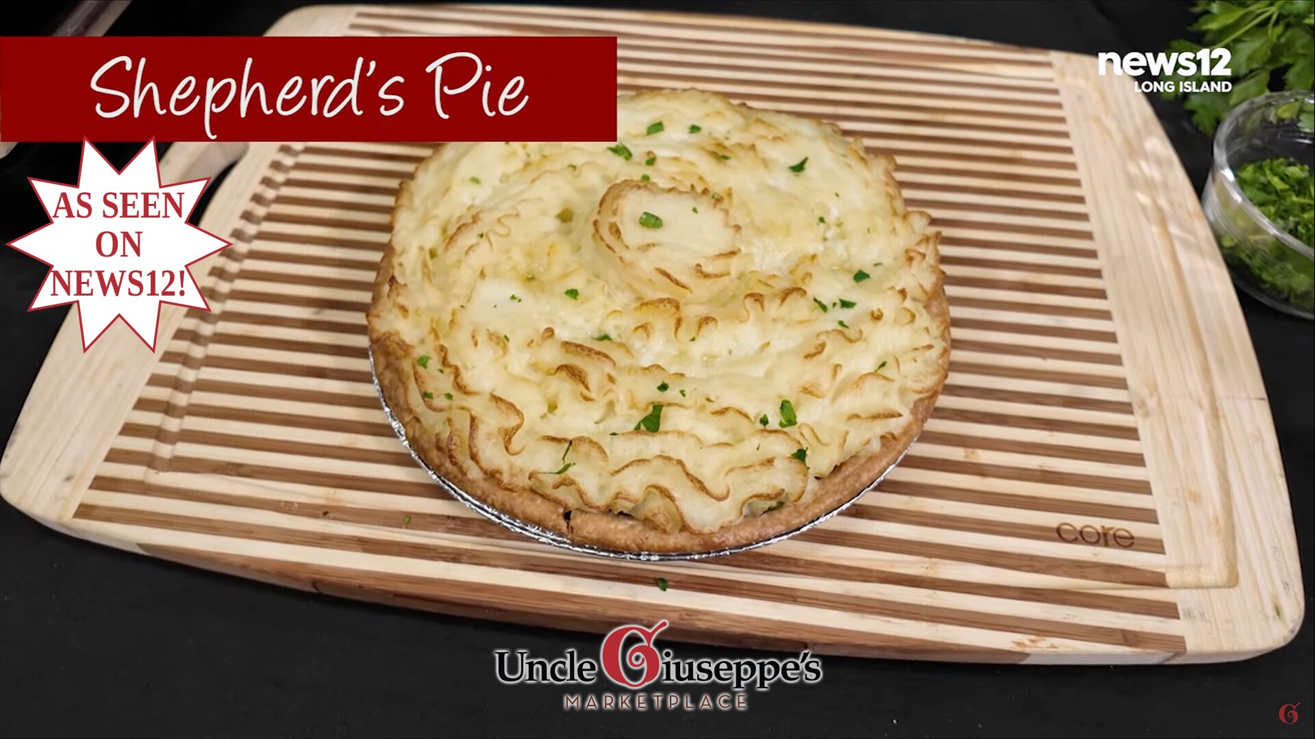 shepherd's pie on a striped cutting board