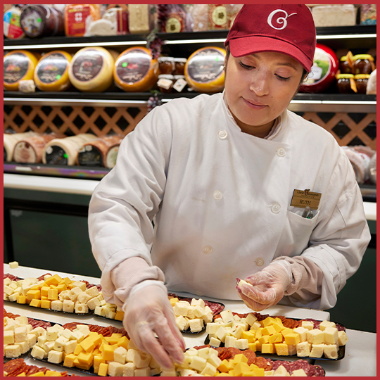 Uncle Giuseppe's worker assembling cheese platters