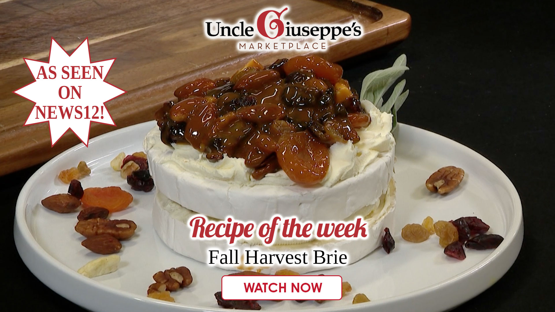 Brie on a white plate topped with nuts and caramel and honey for Fall Brie recipe video