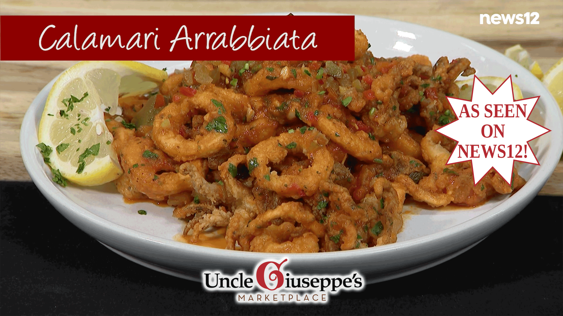 Fried calamari tossed in a red sauce on a white plate