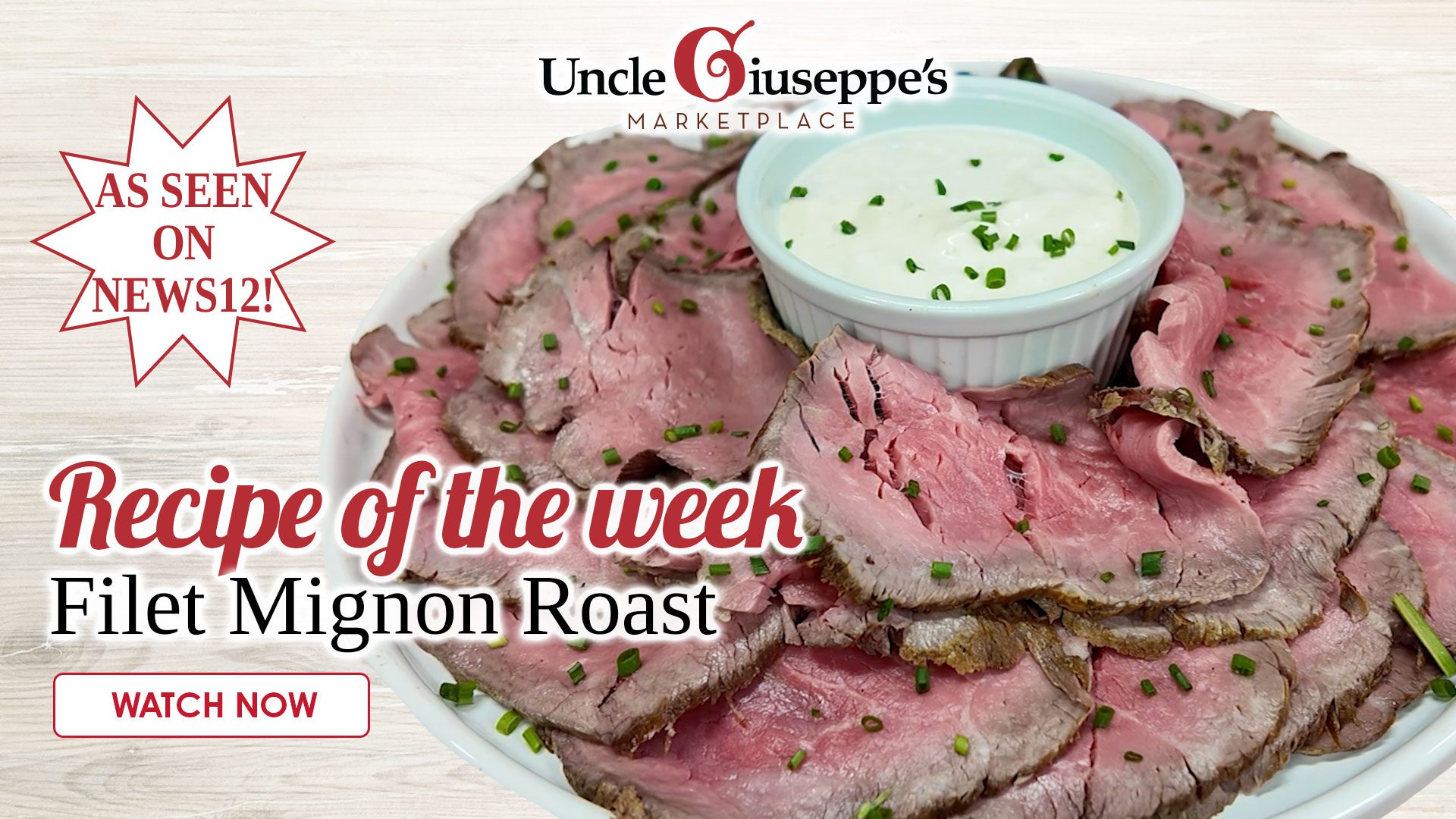 Filet mignon roast sliced on a platter with horse radish sauce in the middle